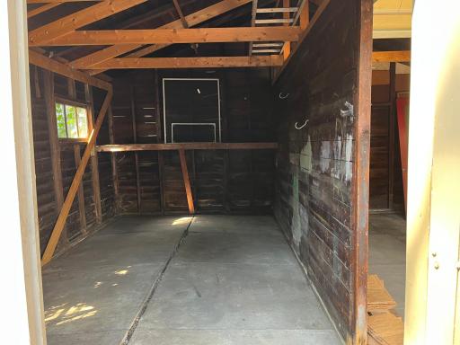 Double garage. This is the side with the "barn doors." The opening is 8' wide x 6' 11" tall. That's a storage shelf in the deep end.