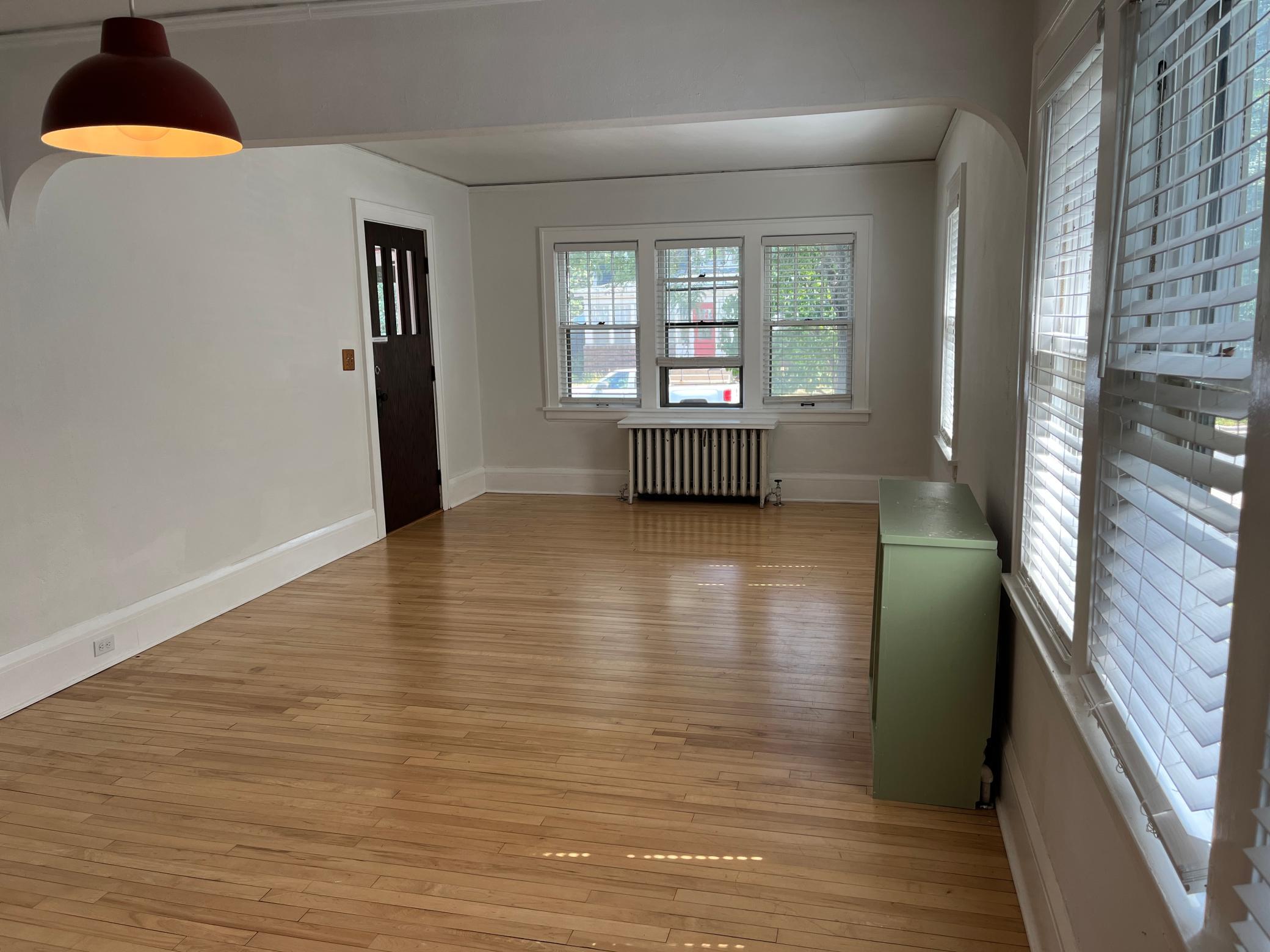 As seen from the informal dining area, the living room measures 15 x 12. Bathed in natural light via eastern and southern exposure.