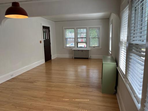 As seen from the informal dining area, the living room measures 15 x 12. Bathed in natural light via eastern and southern exposure.