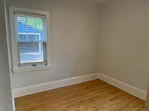 Main Level front bedroom. Same beautiful maple flooring.