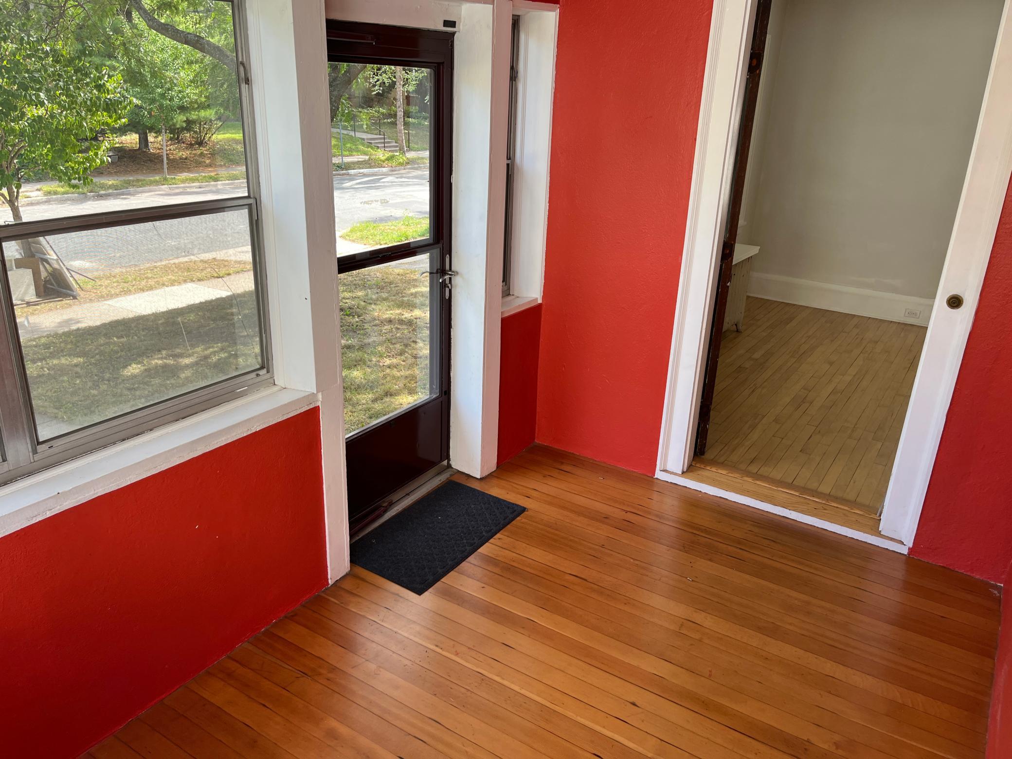 3 season front entry porch with pine flooring.