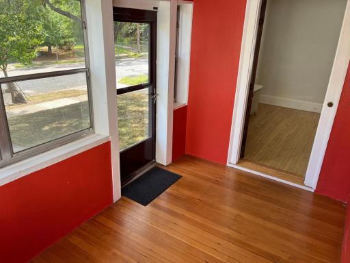 3 season front entry porch with pine flooring.