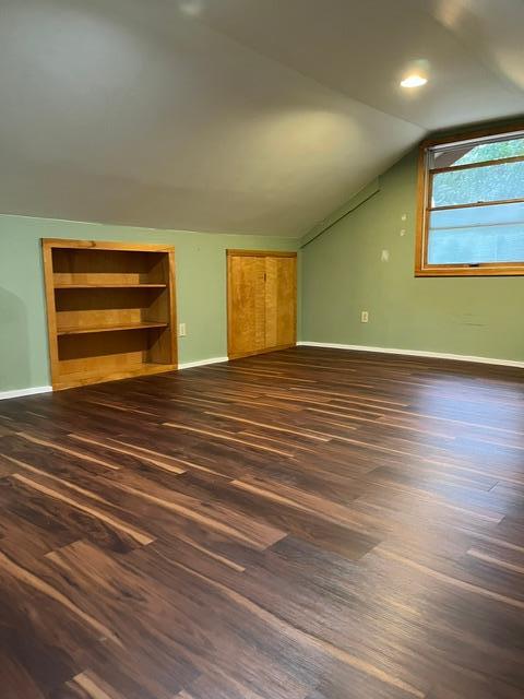 Brand new laminate flooring in the upper level. Built-in bookshelves. Access panel to the under roof area.