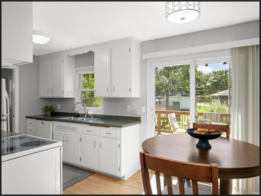 Breakfast nook leading out to deck and fenced in yard