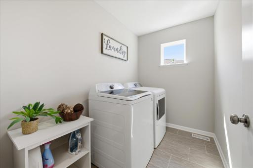 The washer and dryer actually have a room (vs closet) and plenty of space and natural light.