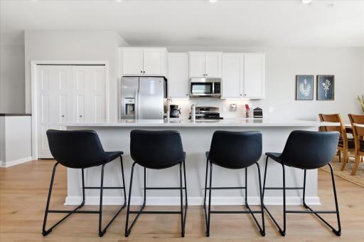 Inside the main level you will find beautiful LVP flooring throughout - and a bright and timeless look with the modern kitchen and over 9ft island with stunning quartz countertops!
