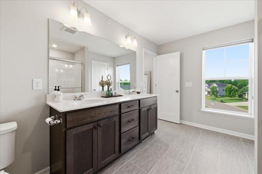 Owners Bath with quart counters, dual sinks, linen closet, shower and an amazing amount of space!