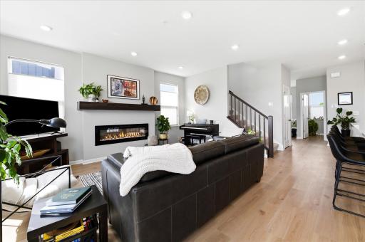 The whole home has been upgraded with window treatments ~ a great perk vs brand new construction. The open staircase also features wood balister on the stairs leading to the upper level. Don't miss the cozy fireplace for those upcoming Fall evenings!