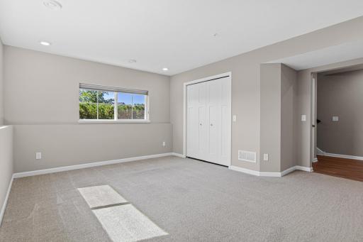 Family room (now vacant) - the closet hosts the mechanical system. This space can very easily be changed to a 4th bedroom!