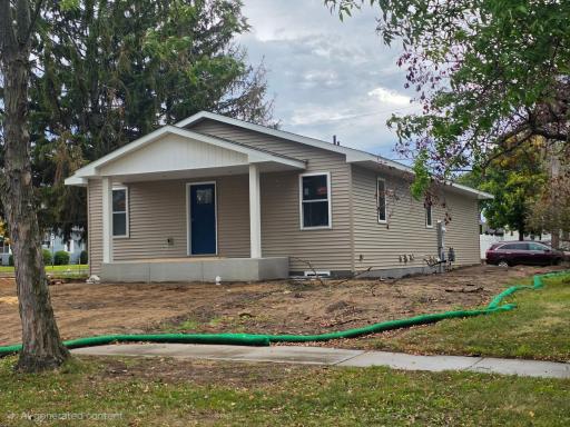 4 beds, 2 baths. Main floor features kitchen, dining and living rooms, as well as 2 bedrooms.