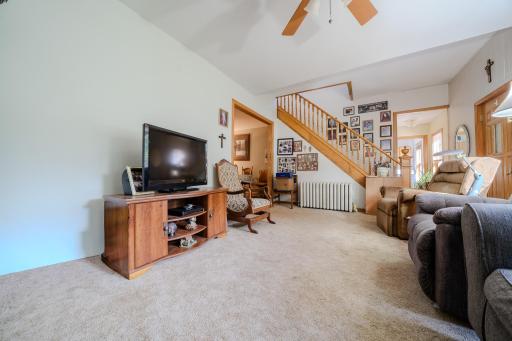 Living room to dining, stairs to upper level