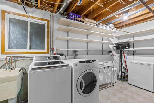 Large laundry room with shelving for all your storage needs