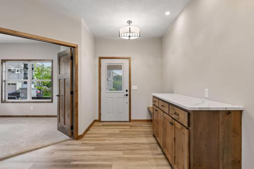 Down the hall you'll find a foyer with more built-in storage and a bench.
