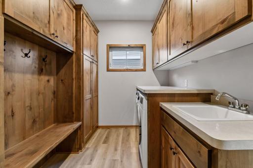 All living facilities on ONE LEVEL - including the mudroom with laundry, ample storage and a utility sink.