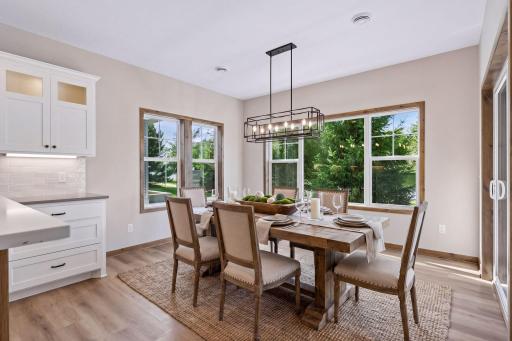 The neighboring dining space offers direct access to the covered patio.