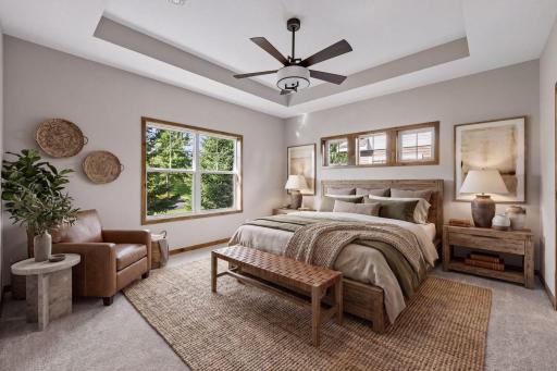 The primary bedroom has a tray ceiling, walk-in closet and a private 3/4 bath retreat.