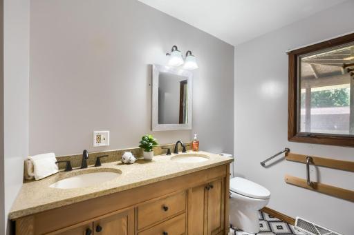 Ensuite bathroom with 2 sinks and granite counter tops.