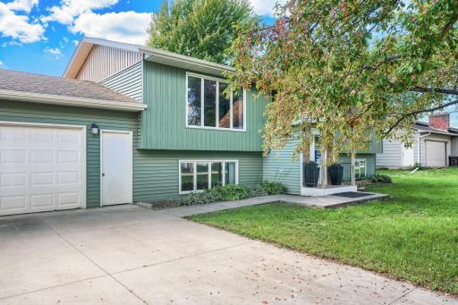 Inviting entrance to home with vinyl siding