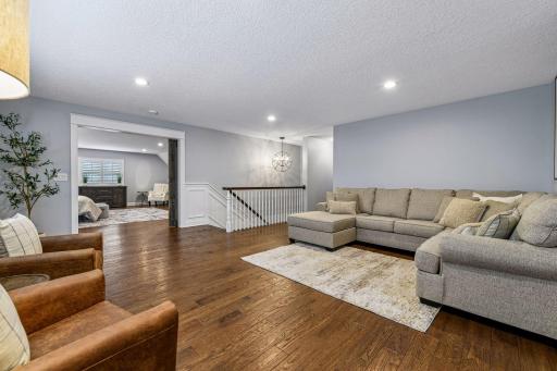 Versatile upper-level loft provides an ideal gathering space for movie nights, homework, or relaxation. Bright, open, and thoughtfully designed for today's lifestyle.