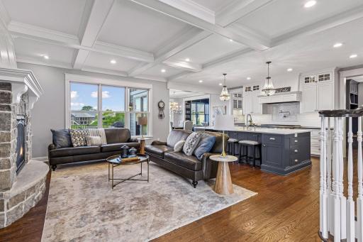 Luxury meets comfort when you step inside this stunning M&M custom built open-concept home. The chef's kitchen has an oversized island, coffered ceilings, hardwood floors, stone fireplace, and expansive windows overlooking picturesque neighborhood.