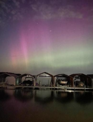 Beautiful photo of the Northern lights right off the dock area at Legacy Village.