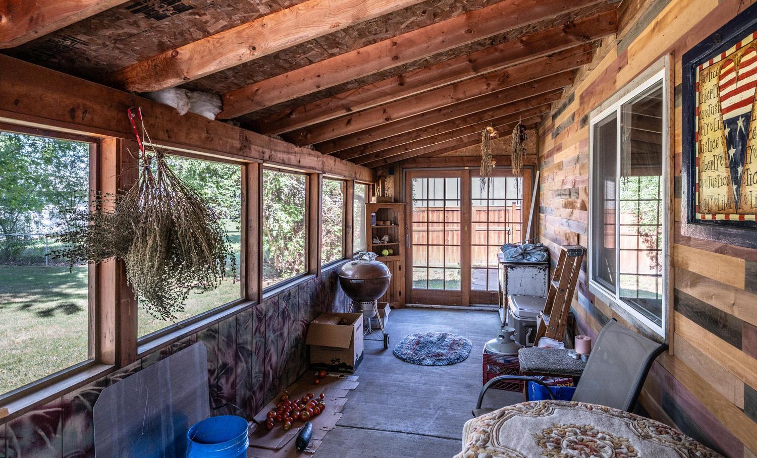 Screened porch on side of detached garage