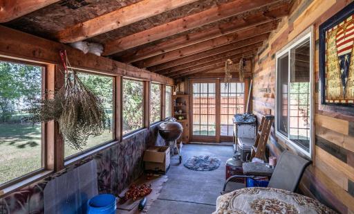 Screened porch on side of detached garage