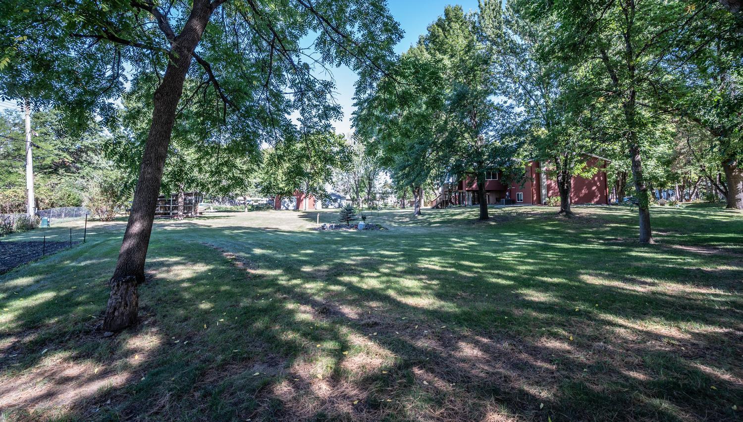 Spacious acreage offers room to roam, explore, garden, and enjoy the outdoors.