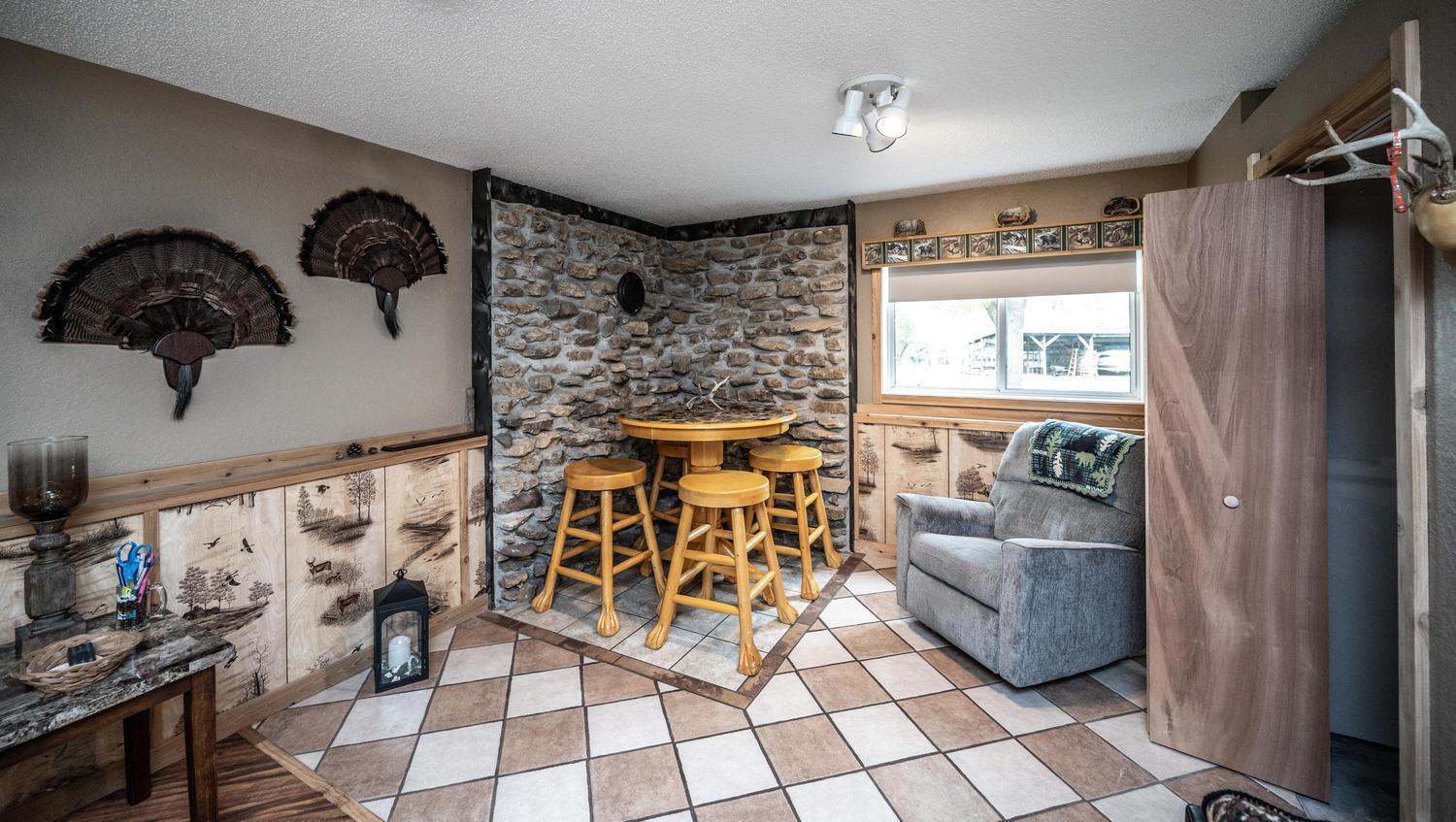 Ready for a cozy touch! The existing setup is ready for a wood-burning stove or fireplace to create a warm and inviting space.