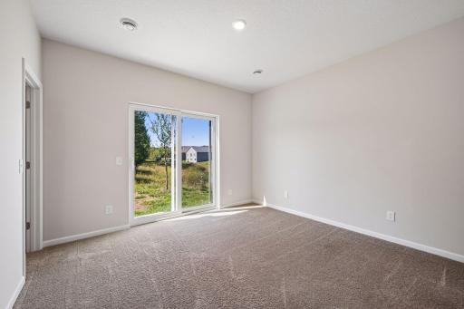 Primary bedroom with sliding door to backyard