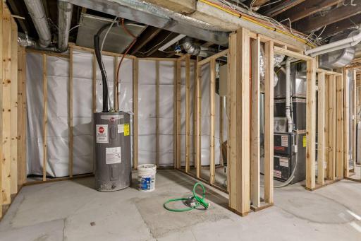 Basement has been roughed-in to include vapor barrier, stud walls, electrical, plumbed-in 3/4 bathroom, 2 egress windows and drain tile system!