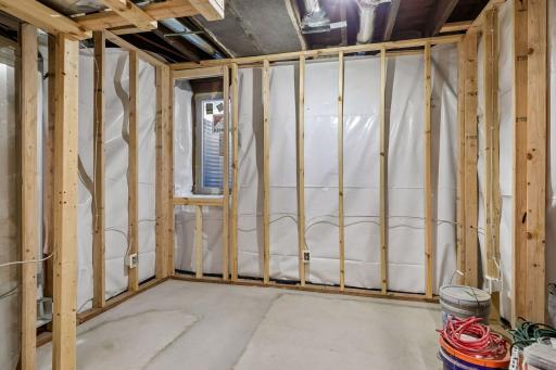 Basement has been roughed-in to include vapor barrier, stud walls, electrical, plumbed-in 3/4 bathroom, 2 egress windows and drain tile system!