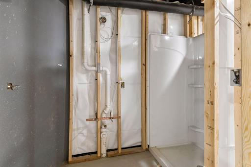 Basement has been roughed-in to include vapor barrier, stud walls, electrical, plumbed-in 3/4 bathroom, 2 egress windows and drain tile system!