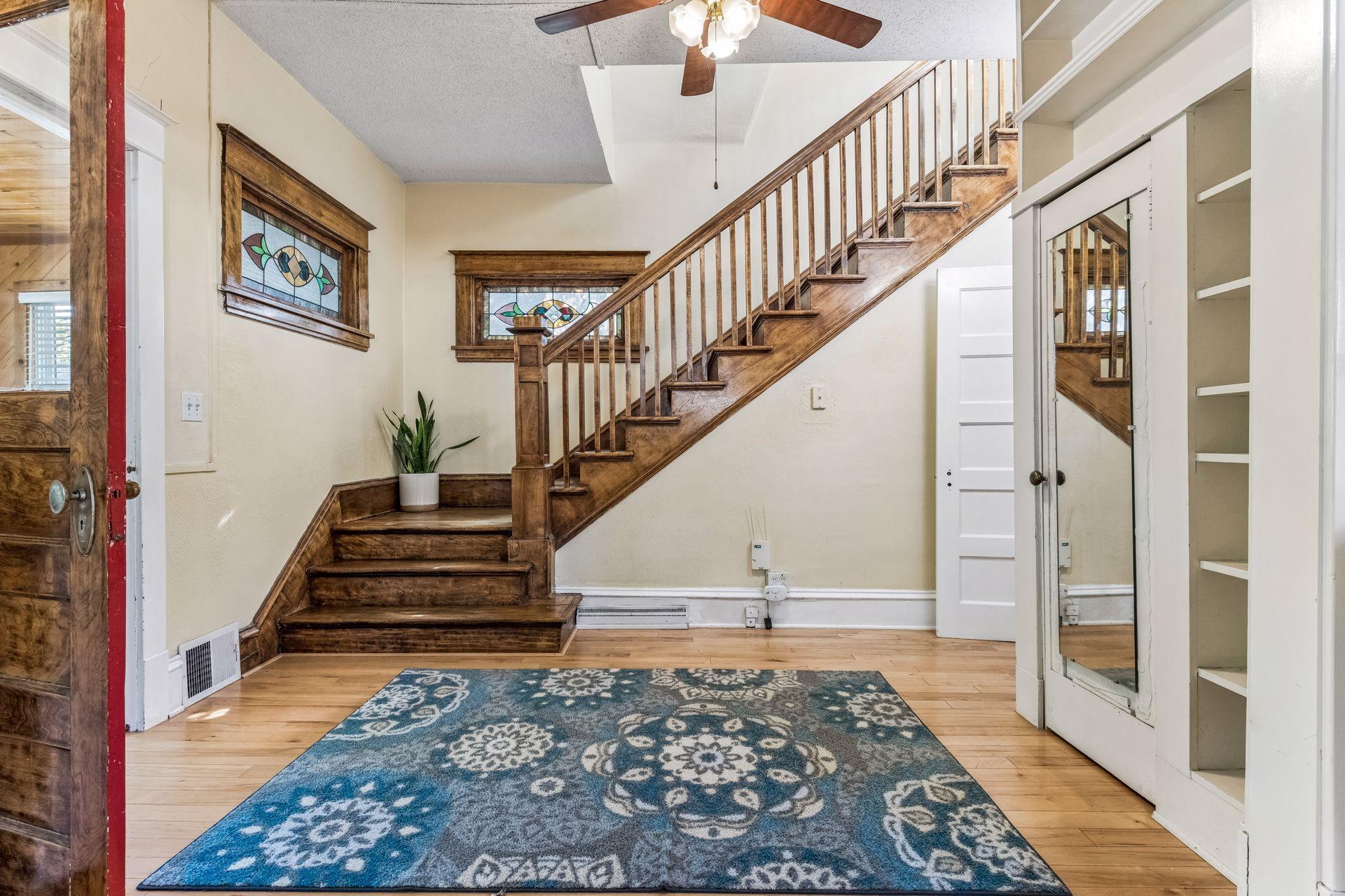 Step inside and discover the craftsmanship of this 1910 home! Beautiful hardwood floors, rich natural woodwork, an original staircase, and a colorful stained-glass window create a memorable first impression.