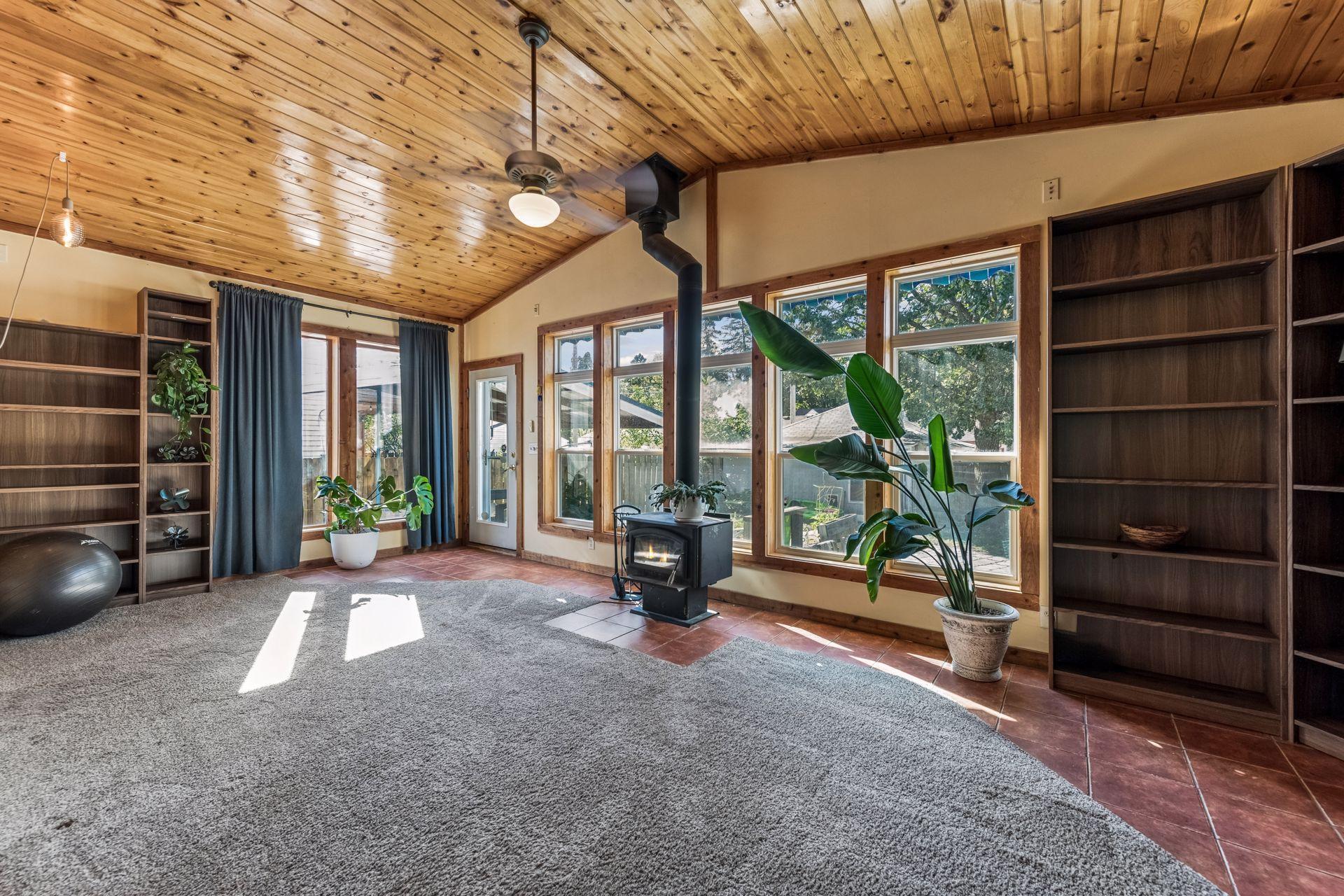 A spectacular wall of windows fills this spacious four-season sunroom with natural light while offering lovely views of the backyard. A wonderful space to enjoy throughout the year!
