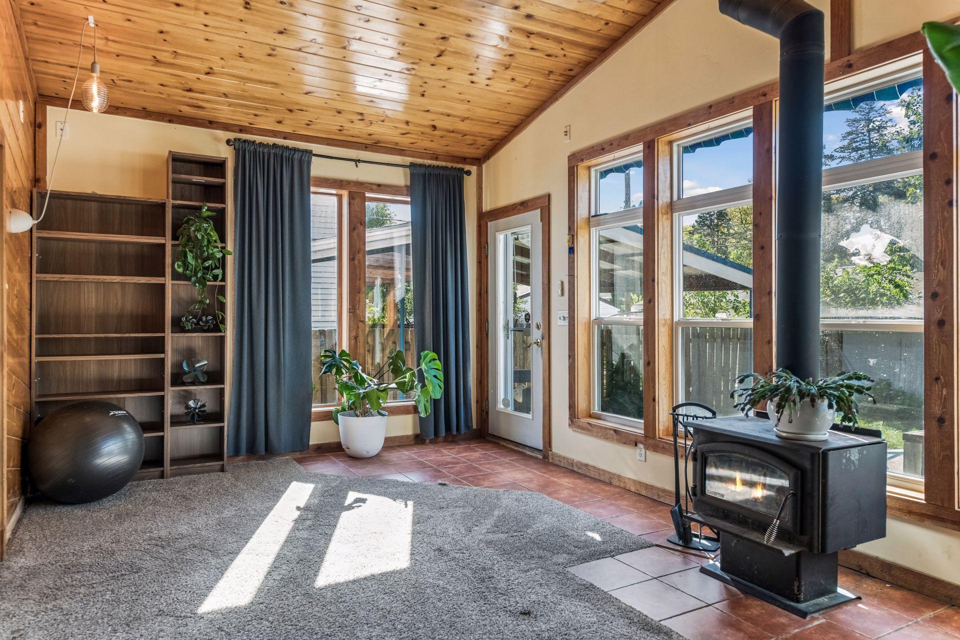 A charming wood-burning stove adds warmth and ambiance