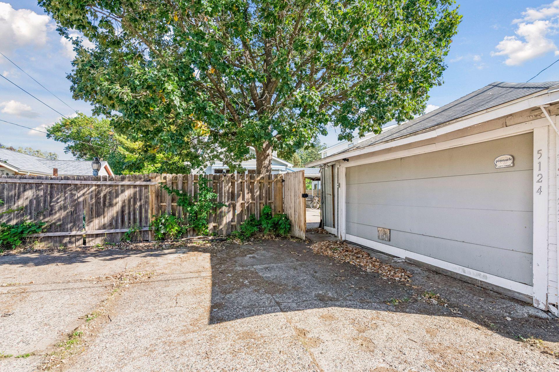 The detached two-car garage offers convenient parking, while an attached storage shed is tucked inside the fully fenced backyard. The driveway offers extra off street parking spaces.