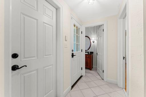 Back entry with doors to attached garage and rear gardens