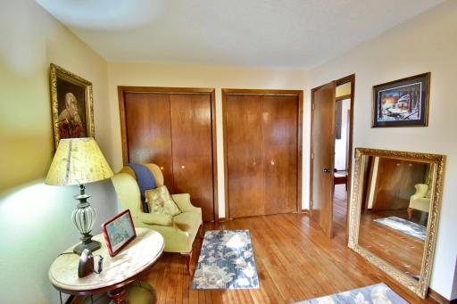 Upper level primary bedroom with double closet space.