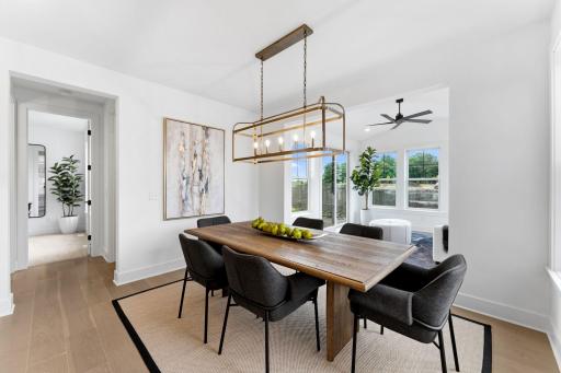 The dining area is ready for enjoying warm morning beverages or piping hot meals with friends and family. Shown here with an optional 4-season porch.
