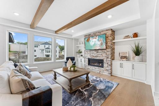 A fireplace provides a cozy ambiance when entertaining or relaxing throughout the week