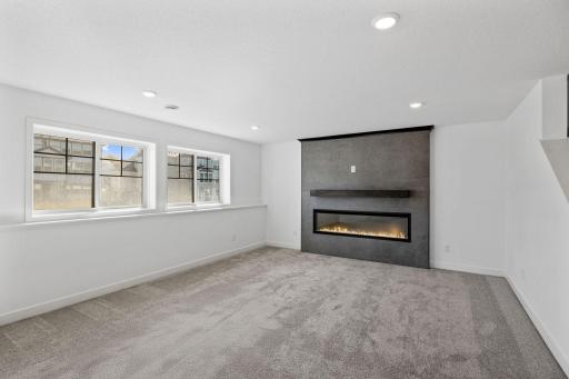 Expanding the home with endless possibilities, the finished lower level includes a sprawling recreation room, a versatile sport court and a fourth bathroom.