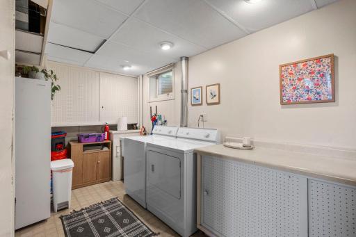 The laundry & utility room offers storage as well