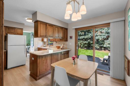 Updated kitchen with an informal eating space that walks out to the patio.