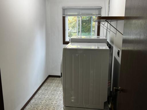 Entry laundry with a wash tub and fresh paint