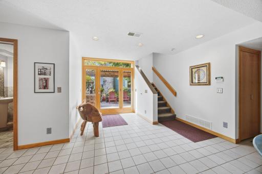 32- Entry, 1/2 bath and staircase to upper levels.