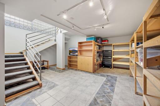 44- Basement is light and bright because of the glass block encased stairwell.