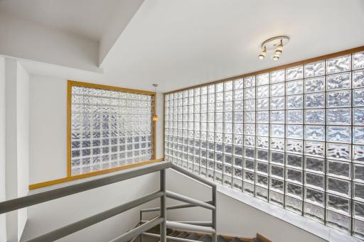 42 Unique glass block encased stairwell to the basement.