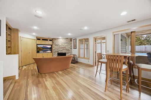 36- Note the leaded glass windows, recessed lighting and built ins around the stone fireplace.