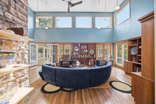 4- "Dramatic two-story great room with custom cherry built-ins, transom windows, and abundant natural light."